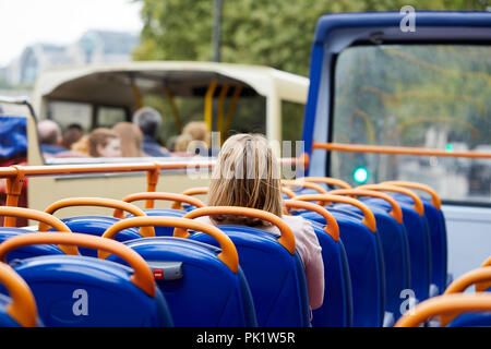 A sightseer on a London tourist bus . Stock Photo