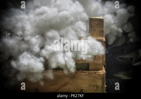 A wooden box with white cotton wool Stock Photo