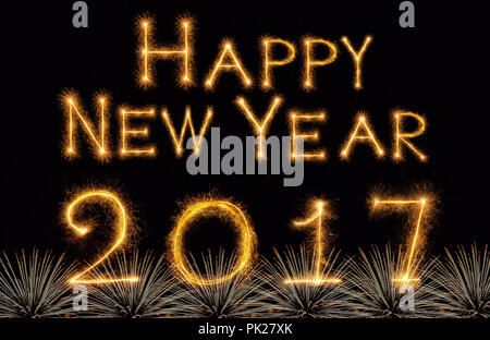 Happy new year 2017 written with Sparkle firework on black background, celebration and greeting cards concept Stock Photo