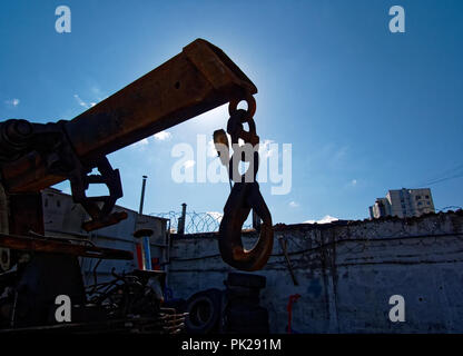 the light of the sun on the background of a street lamp and crane, Moscow Stock Photo