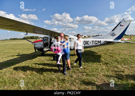 A show of original historical planes and their replicas could be seen at the 9th Letnany Airport Day in Prague, Czech Republic, on September 8, 2018, held on the occasion of the 100th anniversary of the foundation of the Czechoslovak air force and the 60th anniversary of the production of the Blanik glider. In the afternoon, acrobatic pilot Roman Kramarik (pictured with family), the first Czech to fly around the world in a small Cessna P210N plane, landed at the Letnany Airport, ending his mission that started at the Tocna airfield on the outskirts of Prague on July 25. (CTK Photo/Vit Simanek) Stock Photo