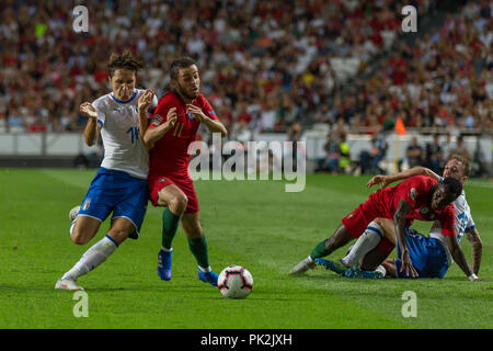 Lisbon, Portugal. 10th September, 2018. Italy's forward Federico Chiesa (14) and Portugal's midfielder Bernardo Silva (11) in action during the game of the Final Tournament of the UEFA Nations League between Portugal and Italy © Alexandre de Sousa/Alamy Live News Stock Photo