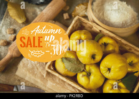 A lot of apple quince  with kitchenware,  preparing for quince pie on sackcloth rustic background. Stock Photo
