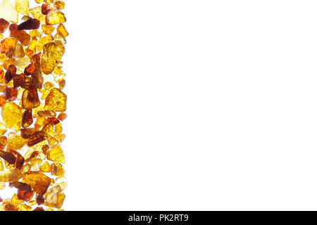 Amber abstract background made of small pieces on the left of frame Stock Photo