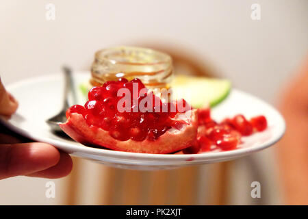 Rosh Hashanah - jewish new year symbols - pomegranate and honey and apple Stock Photo