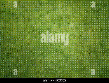 top view of green grass field background in concrete floor Stock Photo
