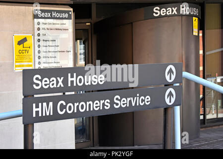 Sign outside front Coroner offices & also home of HM Coroners court & inquest services for Essex in Seax House Chelmsford town centre Essex England UK Stock Photo