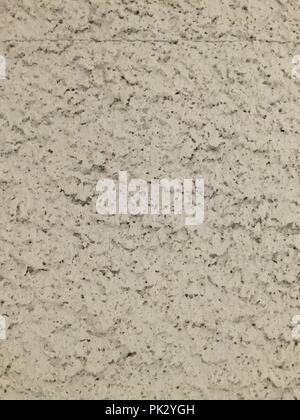 Stucco textured white paint wall backdrop. Stock Photo