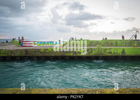 Aguadilla, Puerto Rico. 22, October, 2017. Graffiti on the broken pier of Crash Boat Beach expresses the hopes and determination of residents of Puerto Rico to survive and rebuild their island better than it was before Hurricane Maria destroyed much of its infrastructure in September 2017. Credit: Sara Armas/Alamy Reportage. Stock Photo