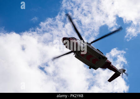 HM Coastguard Bristow search and rescue 936 helicopter hovering overhead during a mountain rescue operation in Snowdonia, Wales, UK, Britain Stock Photo