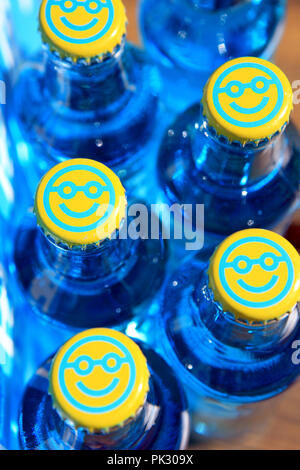 WKD Original Vodka Bluer bottles with smiley faced bottle tops Stock Photo