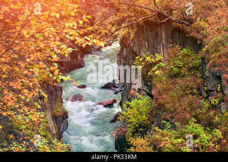 Colorful autumn sunrise in the Caucasus mountains on the Mulkhra river. Upper Svaneti, Georgia, Europe.