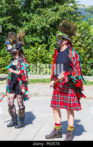 Morris dancers, members of Fox's Morris entertain crowds at the Swanage Folk Festival, Swanage, Dorset UK on a lovely warm sunny day in September Stock Photo