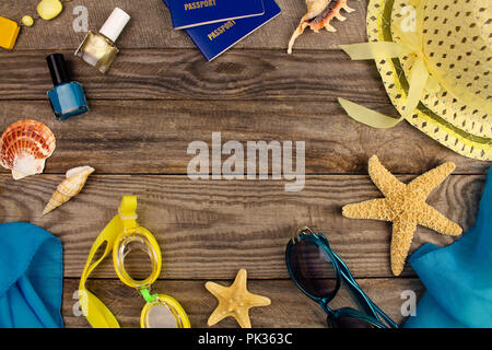 Summer accessories on wooden old background. Top view. Stock Photo