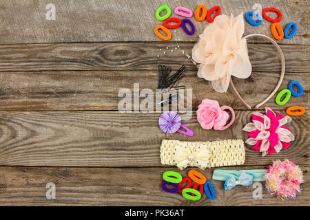 Different hair clips on wooden background. Top view. Stock Photo