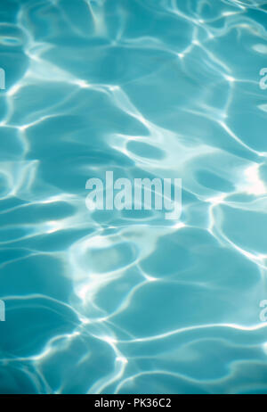 Abstract detail of sunlight reflecting off water in an outdoor swimming pool Stock Photo