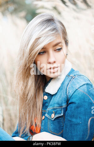 Close-up portrait of a beautiful ????? in a denim jacket Stock Photo