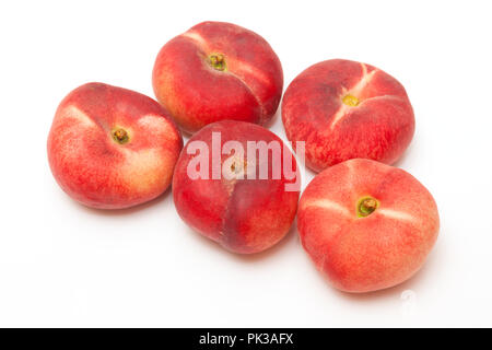 Flat peaches Saturn peach isolated on a  white studio background. Stock Photo