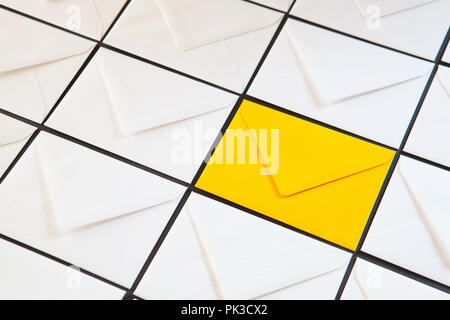 Composition with white and yellow, envelopes on the table. Different colored envelopes on the table. Stock Photo