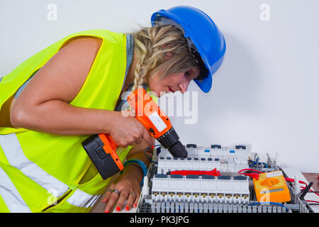 electrician at work in a plant Stock Photo