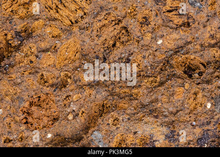 Colorful abstract background of volcanic tuff rock Stock Photo