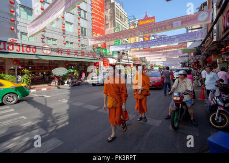 bangkok thailand - february 24,2015 : thai monk walking in yaowarat road ,yaowarat district is important thai - chinese cultural traveling place in he Stock Photo