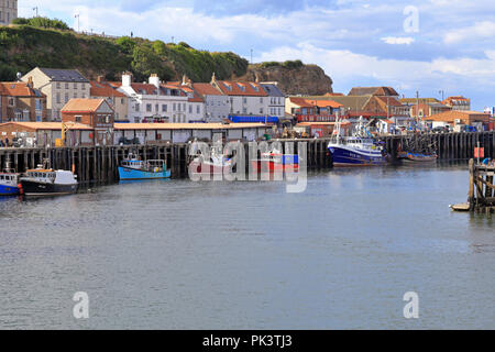 Fishing boats moored by the Whitby Fish Market, Whitby, North Yorkshire, England, UK. Stock Photo