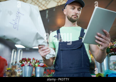 Man Delivering Flowers Stock Photo