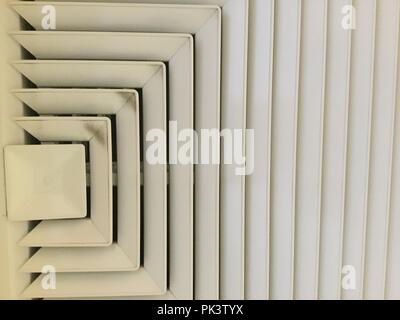 Interior air conditioning vent, half squares geometric design, white. Stock Photo