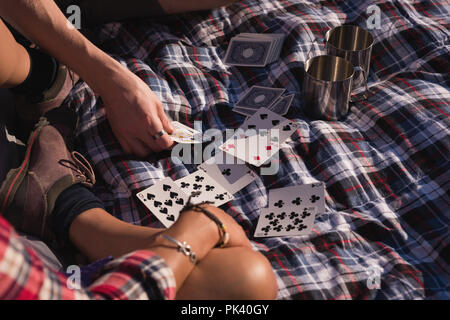 Couple playing with playing cards Stock Photo