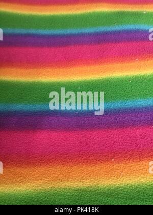 Horizontal multi colored stripes background on fabric. Stock Photo