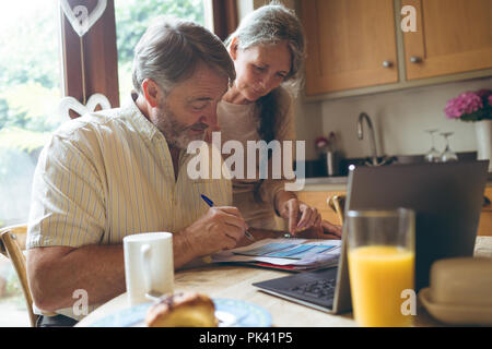 Senior couple checking invoice Stock Photo