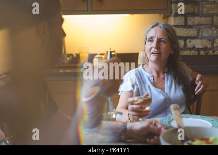 Senior couple interacting with each other on dining table Stock Photo