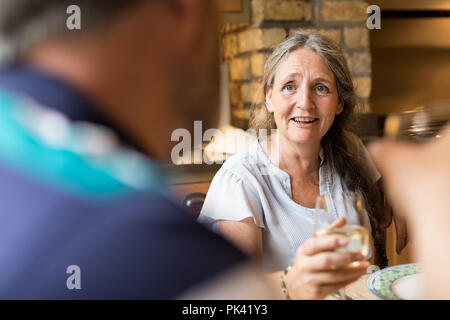 Senior couple interacting with each other on dining table Stock Photo