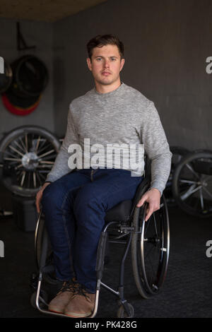 Disabled man in wheelchair at workshop Stock Photo