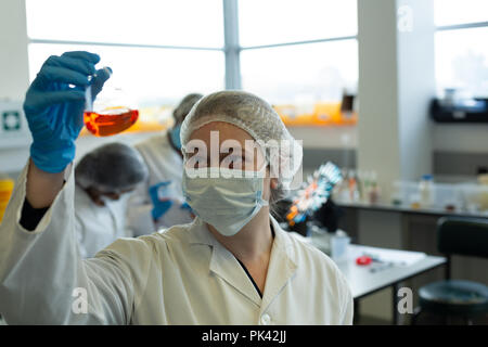 Female scientist experimenting in laboratory Stock Photo