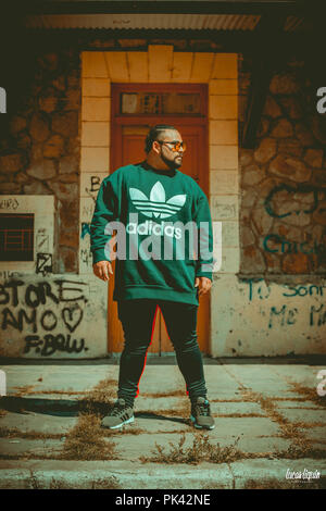 Man modeling at abandoned train station Stock Photo