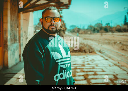 Man modeling at abandoned train station Stock Photo
