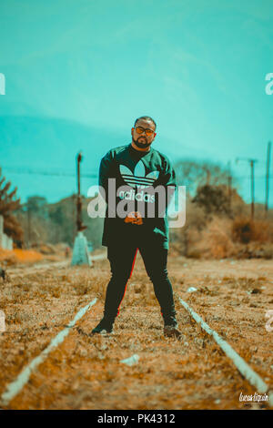 Man modeling at abandoned train station Stock Photo