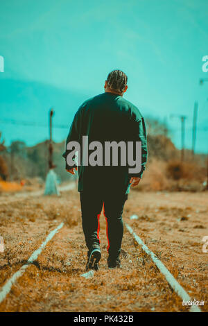 Man modeling at abandoned train station Stock Photo