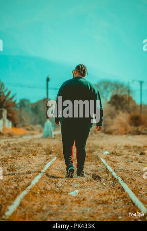 Man modeling at abandoned train station Stock Photo