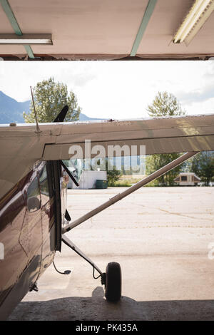 Airplane parked in aerospace hangar Stock Photo
