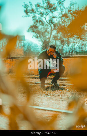 Man modeling at abandoned train station Stock Photo