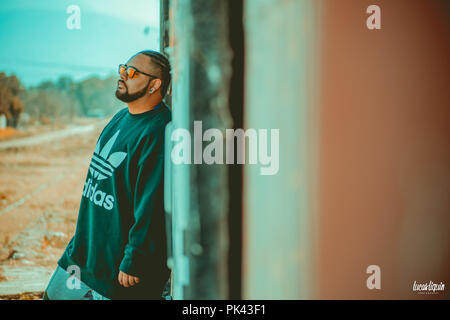 Man modeling at abandoned train station Stock Photo