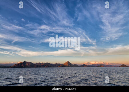 Early morning clouds over Rinca Island in the Komodo National Park. Stock Photo