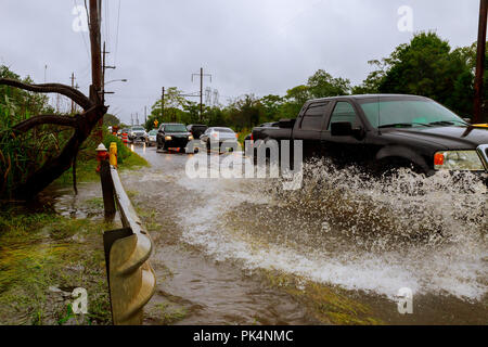 10 SEPTEMBER 2018 NJ USA: Flooded feeder street splash by a car Heavy rains from hurricane Harvey caused many flooded Stock Photo