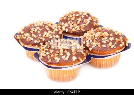 Four muffins with chocolate and nuts isolated on white background. Stock Photo
