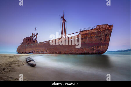 Greek coastline with the famous rusty shipwreck in Glyfada beach near Gytheio, Gythio Laconia Peloponnese Greece. Stock Photo