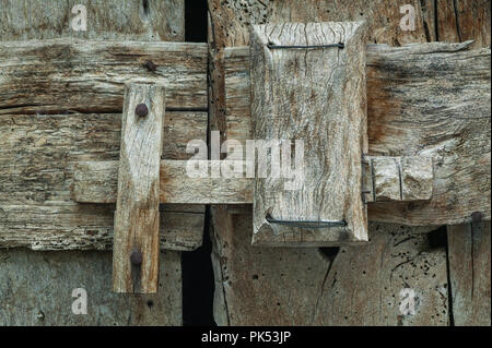 Traditional closing system for the door of a cellar or a stable. Traditional and unique closure of the ancient village of San Benedetto in Perillis. Stock Photo
