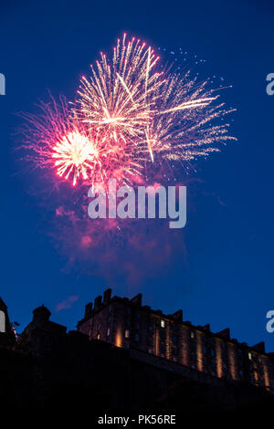 Fireworks end an Edinburgh Tattoo performance, seen over the Castle from Castle Terrace. Stock Photo